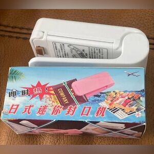 White and Pink Handheld Sealer